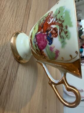 Vintage Gold-Trimmed Porcelain Pedestal Cup with Romantic Scene